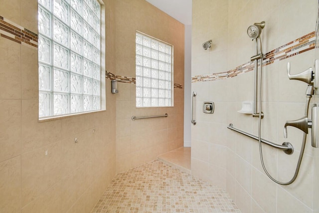 bathroom with tiled shower