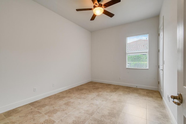 unfurnished room featuring light tile patterned floors and ceiling fan