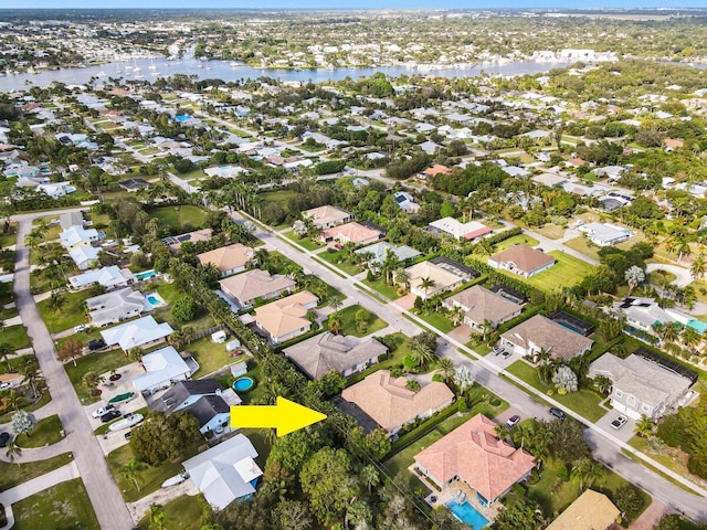 birds eye view of property featuring a water view