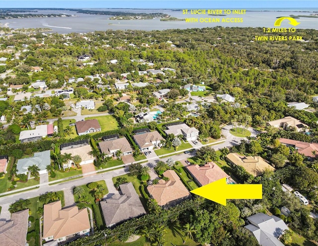 birds eye view of property with a water view