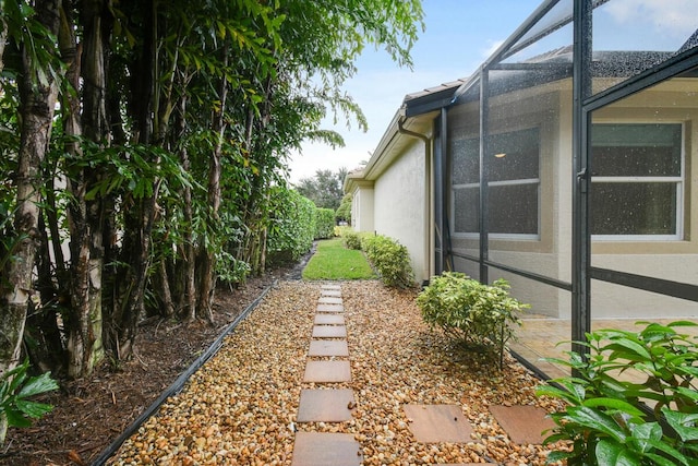 view of yard with a lanai