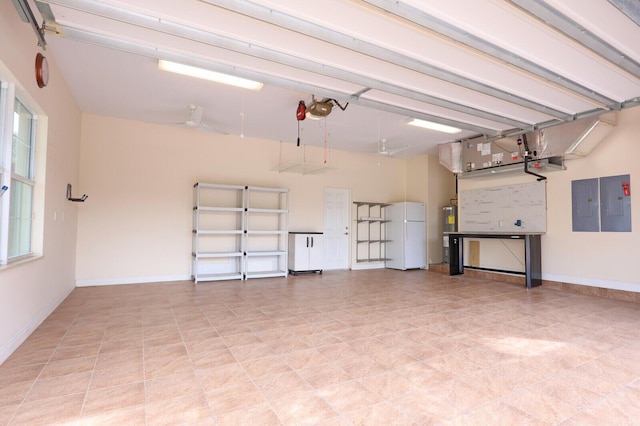 garage with electric panel, a garage door opener, and white fridge