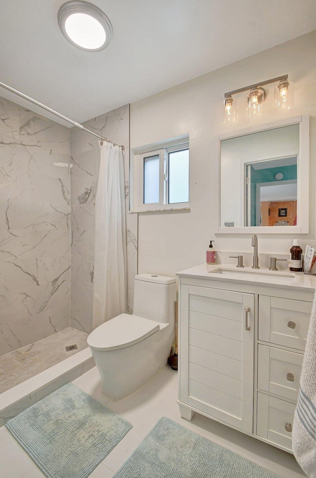 bathroom featuring tile patterned floors, vanity, toilet, and walk in shower