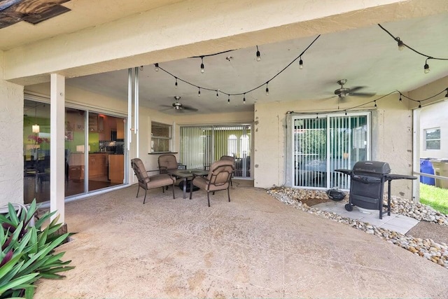 view of patio with area for grilling and ceiling fan