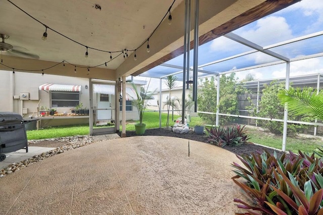 view of patio / terrace featuring a lanai