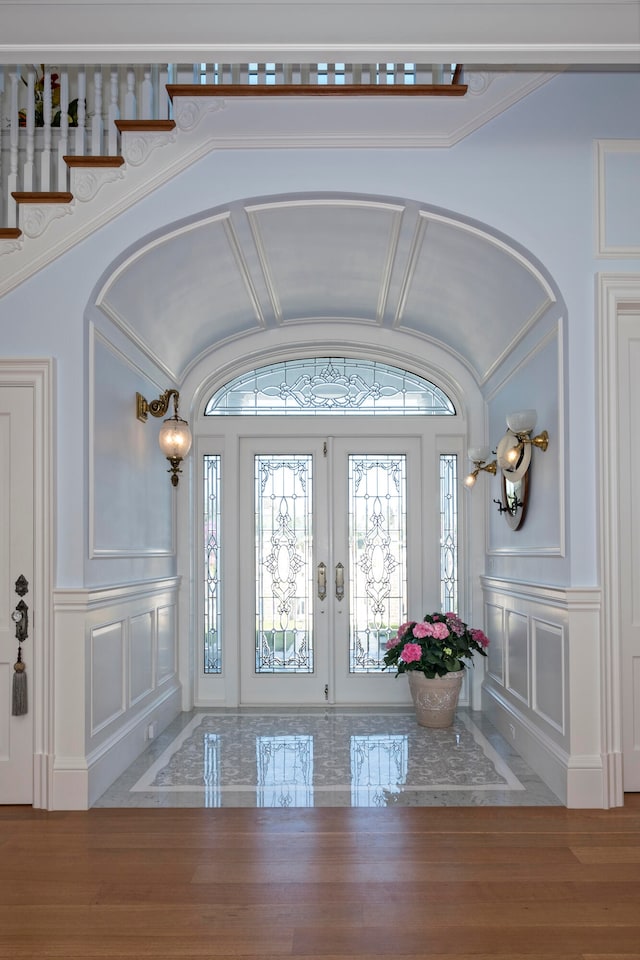 entrance foyer featuring french doors and hardwood / wood-style floors