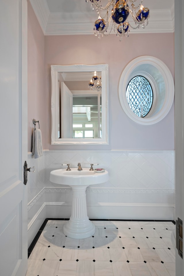 bathroom featuring a wealth of natural light and ornamental molding