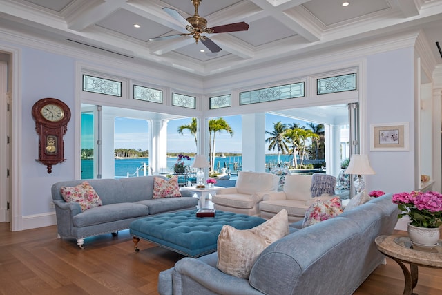 living room featuring hardwood / wood-style floors, coffered ceiling, a water view, crown molding, and beam ceiling