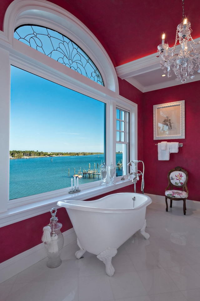 bathroom with a water view, a bathtub, and ornamental molding