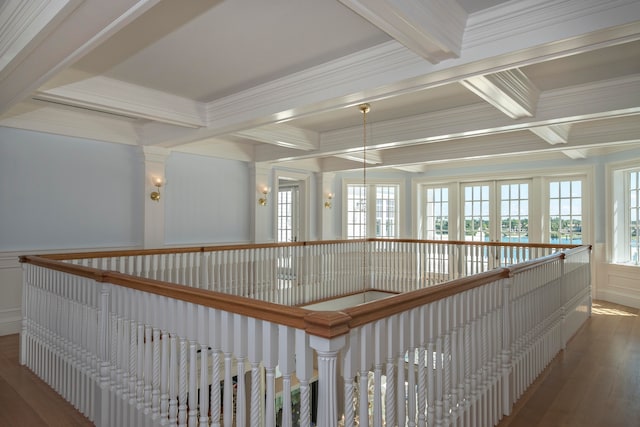 hall featuring beamed ceiling, dark hardwood / wood-style flooring, ornamental molding, and coffered ceiling