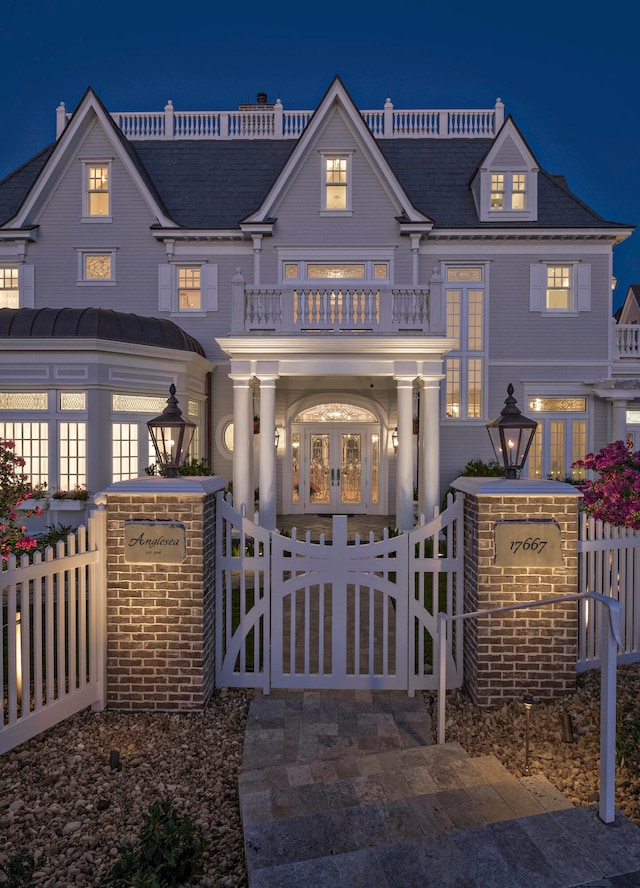 view of front of home with a balcony