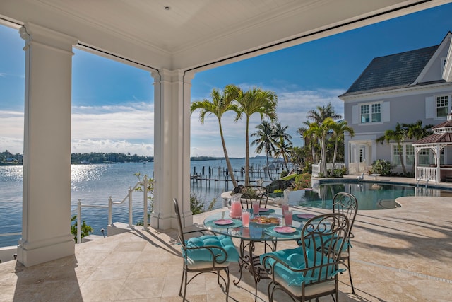 view of patio featuring a water view