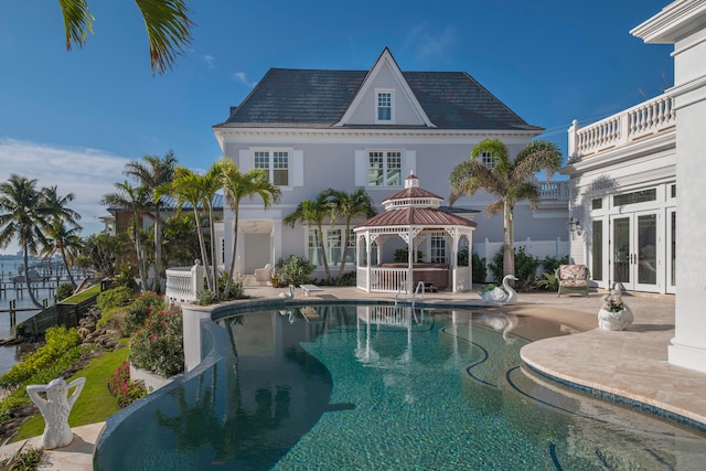 view of swimming pool with a gazebo, a jacuzzi, french doors, and a patio