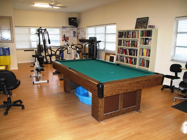 recreation room with ceiling fan, plenty of natural light, light hardwood / wood-style floors, and billiards