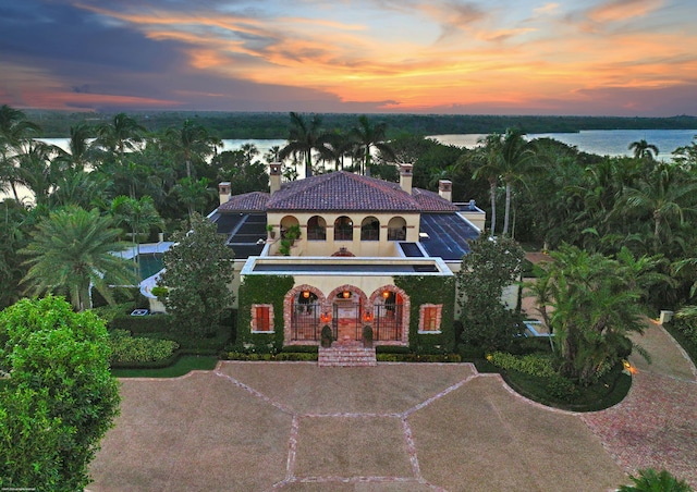 view of front of home featuring a water view and covered porch