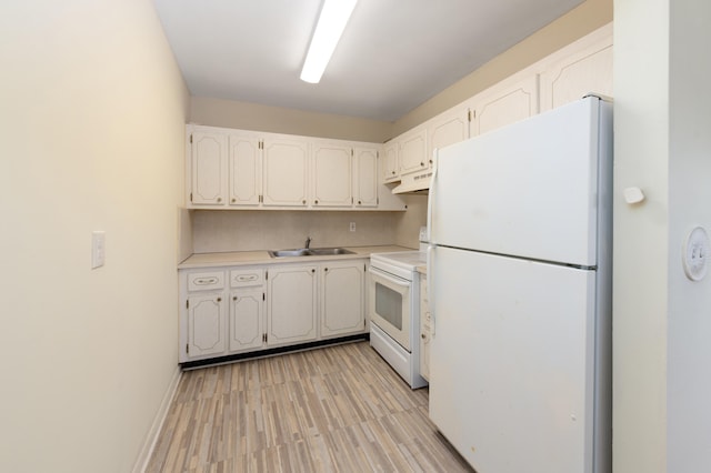 kitchen with white cabinetry, white appliances, sink, and light hardwood / wood-style flooring