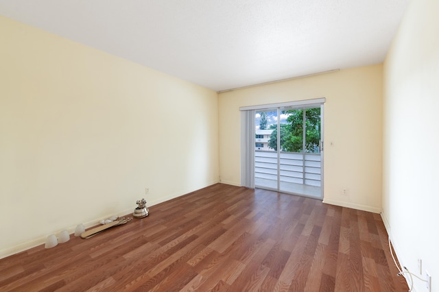 spare room featuring hardwood / wood-style floors