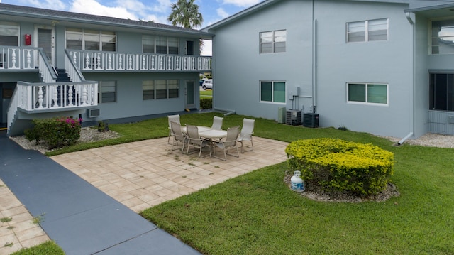 exterior space featuring a yard, a patio, and central AC unit