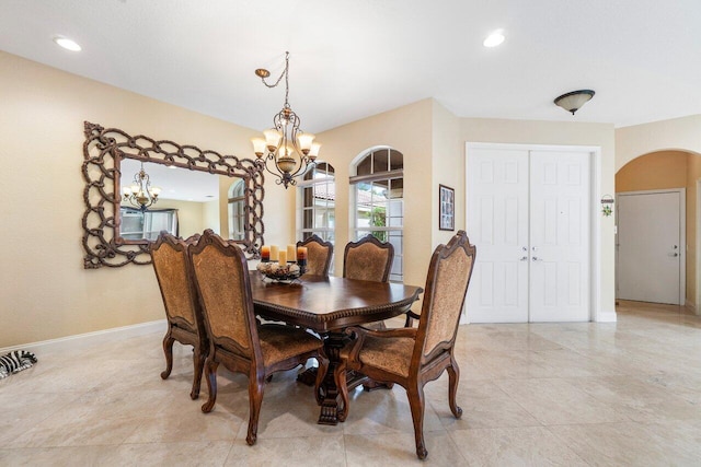 dining area featuring a notable chandelier