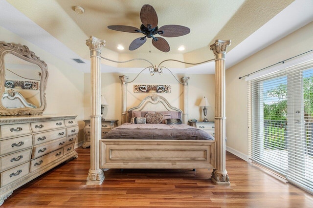 bedroom featuring a textured ceiling, access to exterior, ceiling fan, and dark hardwood / wood-style floors