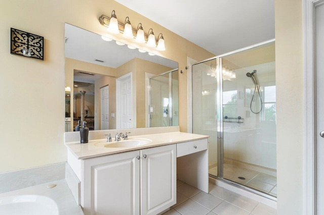 bathroom featuring vanity, tile patterned floors, and a shower with door