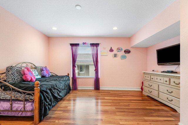 bedroom featuring light wood-type flooring