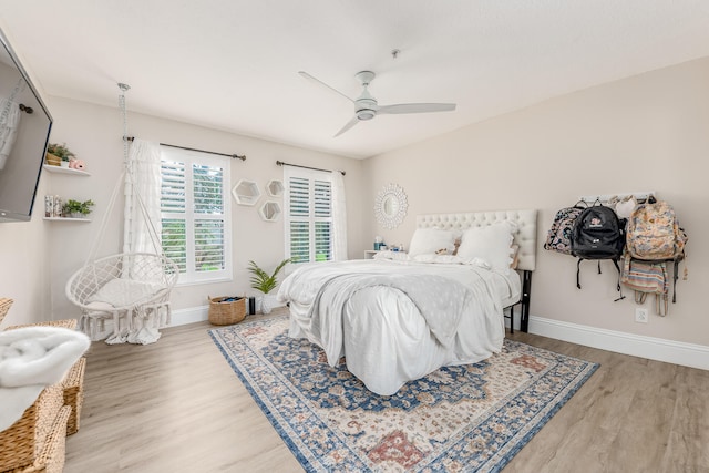 bedroom featuring wood-type flooring and ceiling fan