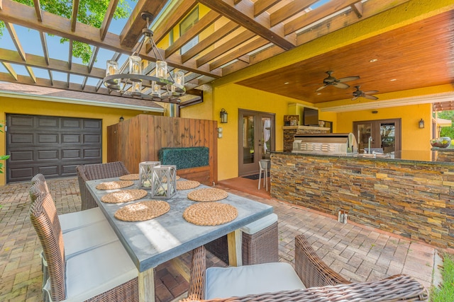 dining space with ceiling fan and french doors