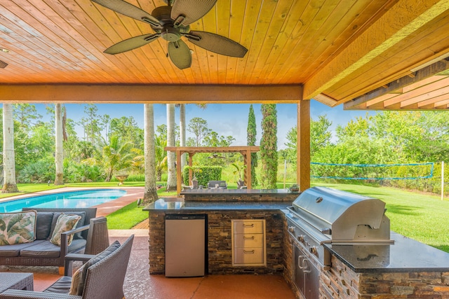 view of patio featuring outdoor lounge area, an outdoor kitchen, and area for grilling