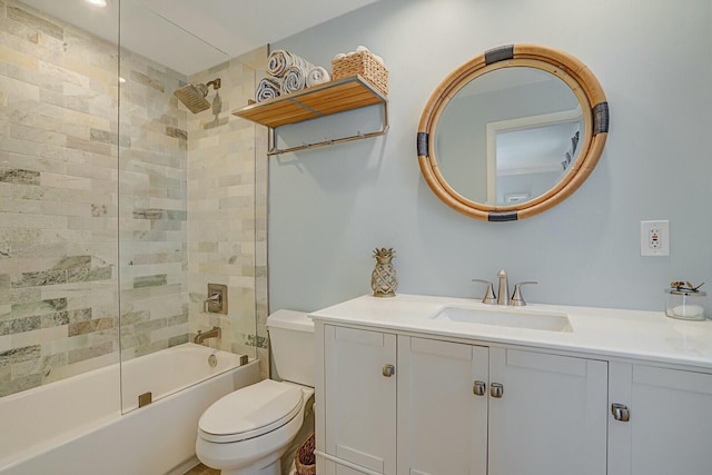 bathroom with toilet, vanity, and shower / bathing tub combination