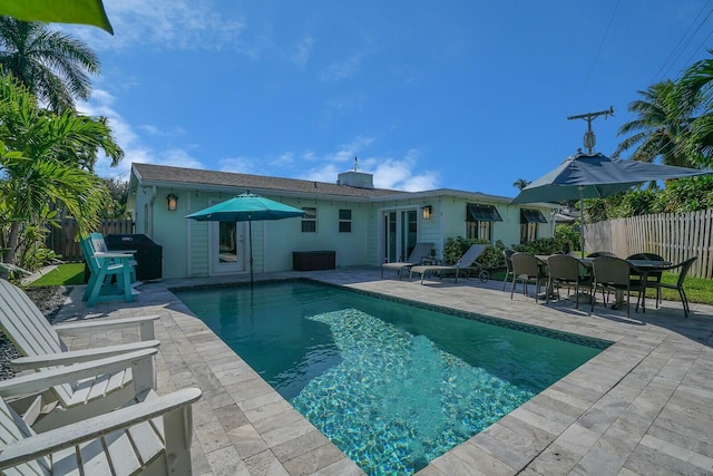 view of pool with a patio area, fence private yard, and a fenced in pool