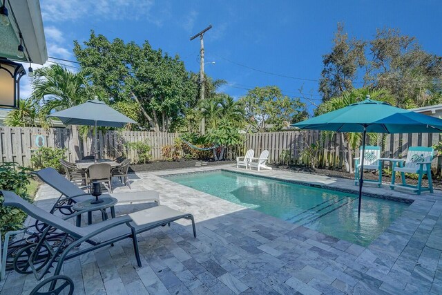 view of swimming pool featuring a patio area