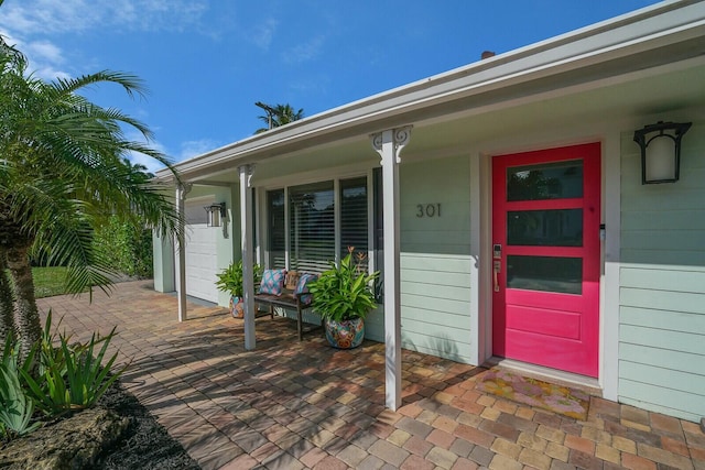 doorway to property with a porch