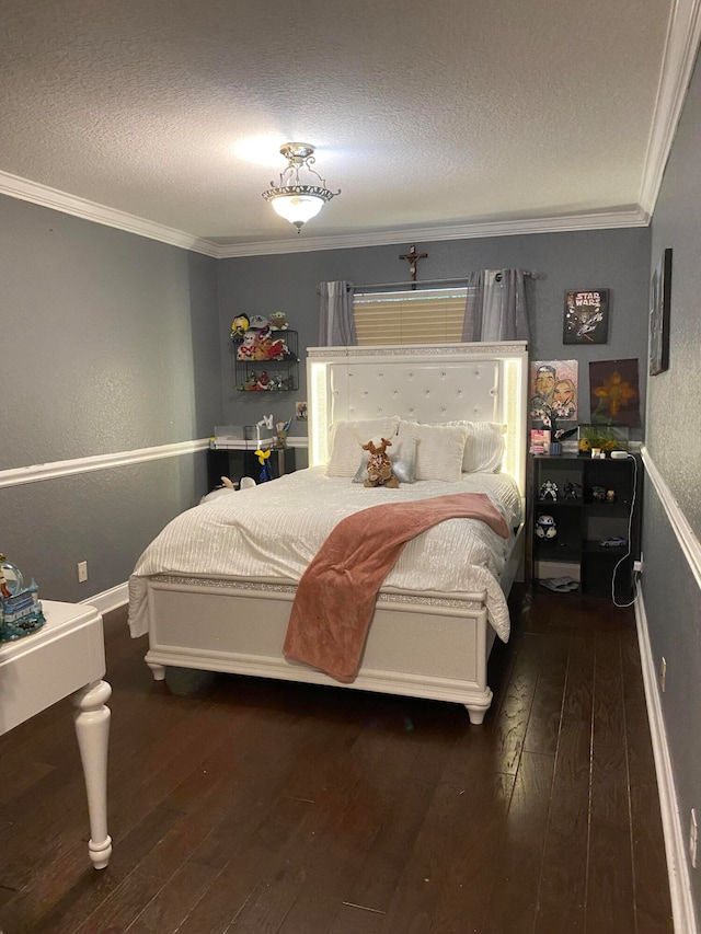 bedroom with a textured ceiling, dark hardwood / wood-style floors, and ornamental molding