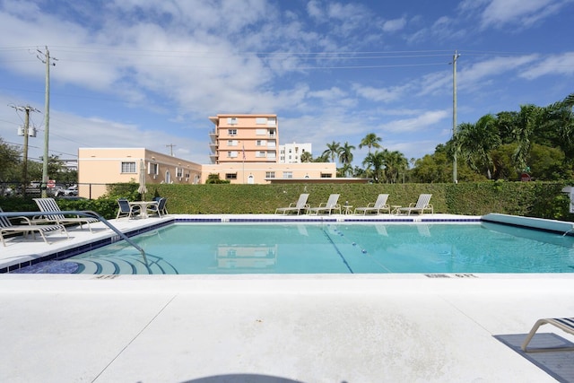 view of swimming pool featuring a patio area