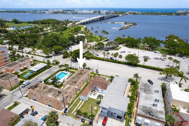 birds eye view of property with a water view