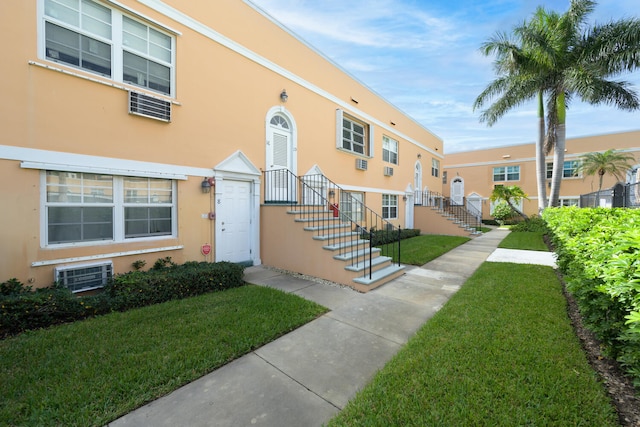 exterior space with a yard and central air condition unit