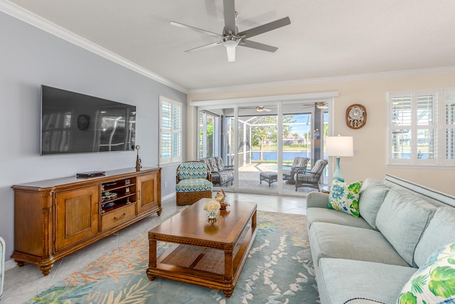 tiled living room with ceiling fan and ornamental molding