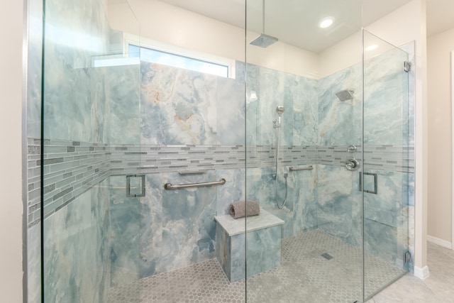 bathroom featuring tile patterned flooring and a shower with door