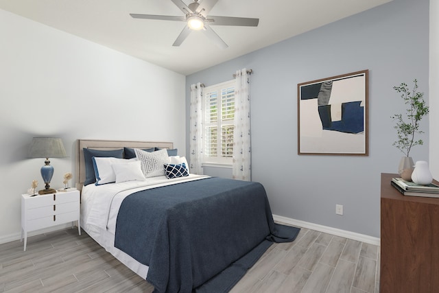 bedroom with ceiling fan and light wood-type flooring