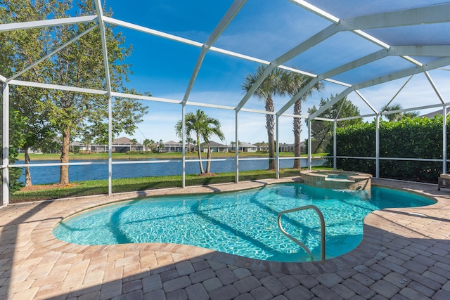 view of swimming pool featuring glass enclosure, a patio area, a water view, and an in ground hot tub