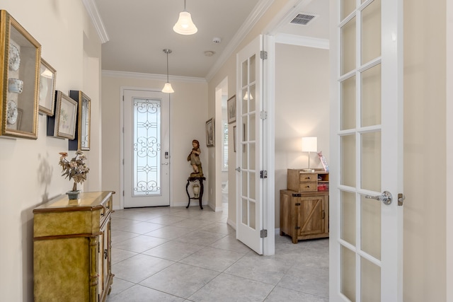 tiled foyer entrance featuring french doors and ornamental molding