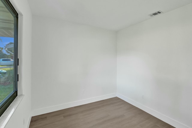 unfurnished room featuring wood-type flooring