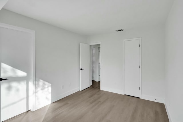 unfurnished bedroom featuring light hardwood / wood-style floors