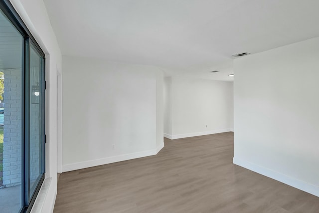 empty room featuring wood-type flooring