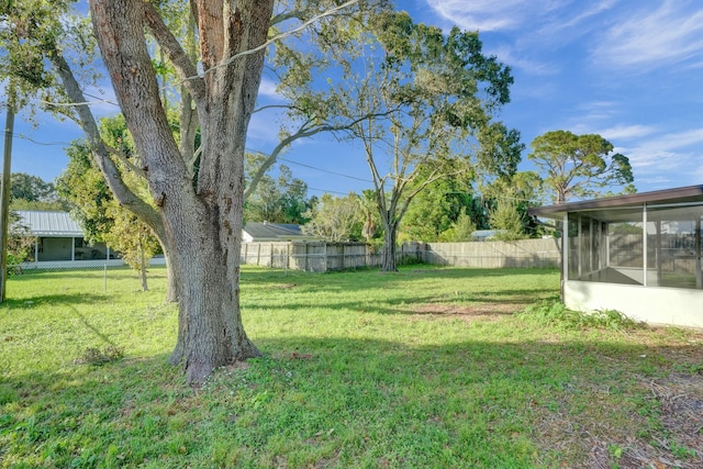 view of yard with a sunroom