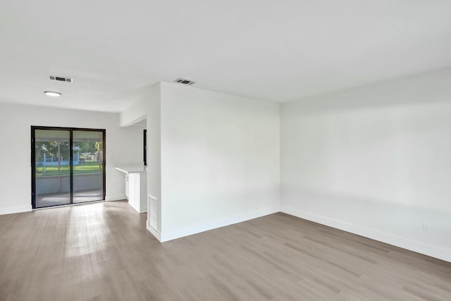 spare room with light hardwood / wood-style floors