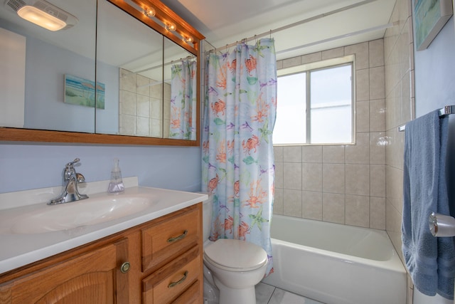 full bathroom featuring tile patterned flooring, vanity, shower / bath combination with curtain, and toilet