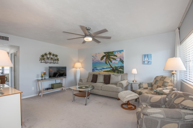 living room with ceiling fan and light colored carpet