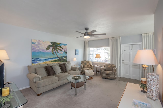 living room with light carpet and ceiling fan